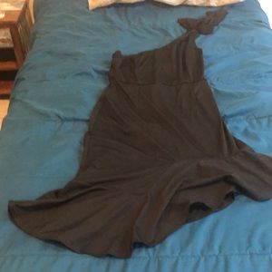 Black one shoulder dress.